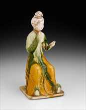 Seated Woman Holding Mirror, Tang dynasty (A.D. 618-907), first half of 8th century. Creator: Unknown.