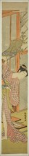 Young Woman Hanging a Painting, c. 1771. Creator: Isoda Koryusai.