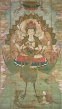 Mahamayuri Vidyaraja, Liao dynasty (916-1125), 11th century. Multi-armed deity or bodhisattva seated on a lotus flower, carried on the back of a peacock.