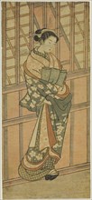 Courtesan Standing in Front of a Barred Window, c. 1765. Attributed to Ishikawa Toyonobu.
