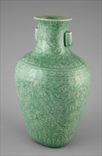 Jar with Tubular Handles, Peonies, 'Endless Knot,' Pendant Balls, and Pendant Lozenges, Qing dynasty (1644-1911), Qianlong reign mark and period (1736-1795). Green glazed vessel decorated with floral ...