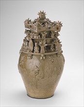 Funerary Urn (Hunping), Western Jin dynasty (A.D. 265-316), late 3rd century. Medium sized olive colored urn, upper half carved into figures and structures.