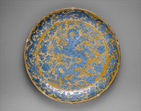 Large Plate with Dragons, Clouds and Floral Sprays, Ming dynasty (1368-1644), mark and reign of Jiajing (1522-66).
