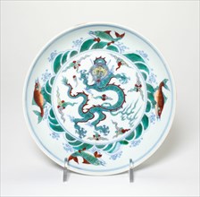 Dish with Dragon amid Flames Encircled by Fish amid Waves, Qing dynasty (1644-1911), 18th/19th century.