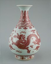 Bottle Vase with Dragons amid Clouds, Chasing Flaming Pearls; Pendant Ruyi; Lingzhi Scrolls; Upright Leaves and Petal Panels; and Florets Encircling Foot, Qing dynasty (1644-1911), Qianlong reign mark...