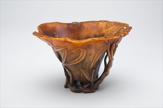 Cup in the Form of an Open Lotus Leaf, with Water Weeds and Grasses Amongst Lotus Buds and Stalks, Late Ming (1368-1644) or early Qing dynasty (1644-1911), 17th/18th century.