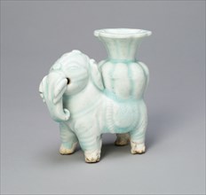 Joss-Stick Holder in the Form of an Elephant Holding a Lobed Vase, Yuan dynasty (1271-1368).