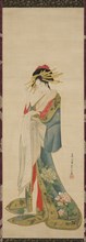 A Courtesan Reading a Letter, 1820/25. Woman with elaborate shimada hairstyle, wearing a kimono with peony design.