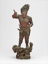 Shukongojin, Kamakura Period, 12th/14th century. A wooden sculpture of a muscular red figure with flaming hair and a third eye, stares fiercely down at us. Left head raised over head holds a vajra, a ...