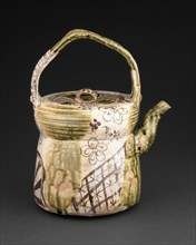 Oribe-Type Ewer, early 17th century. Greenish brown ceramic kettle with floral and geometric designs.