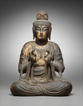 Seated Bodhisattva, 8th century. Seated wooden Buddha statue with with forefinger touching thumb.