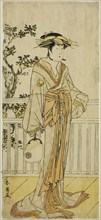 The Actor Iwai Hanshiro IV as Okumi of the Mieido Fan Shop (?) in the Play Sanjuk-koku Yobune no Hajimari (?), Performed at the Ichimura Theater (?) in the Fifth Month, 1789 (?), c. 1789.