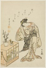 Young Woman with a Caged Monkey (Calendar Print for New Year 1776), Japan, 1776.