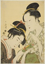 Okita and Ofuji, Japan, c. 1793/94. The once famous but now middle-aged beauty Ofuji, wearing a gingko-patterned robe, hands a scroll to the young waitress Naniwaya Okita. The scene is thought to symb...