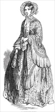 Paris Fashions for June - Promenade Dress, 1850. Creator: Unknown.