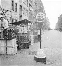 Play street for children, Sixth Street and Avenue C, New York City, 1936. Creator: Dorothea Lange.