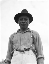 At Hill House, Mississippi - He wears the union button, 1936. Creator: Dorothea Lange.