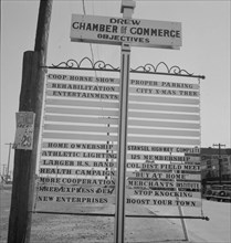 Chamber of Commerce sign, Drew, Mississippi, 1937. Creator: Dorothea Lange.