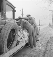 En-route to pea harvest in Imperial Valley, U.S. 99, Tulare, California, 1939. Creator: Dorothea Lange.