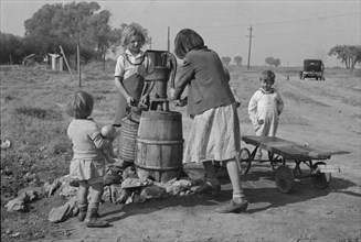 Water supply, American River camp, California, San Joaquin Valley, CA, 1936. Creator: Dorothea Lange.