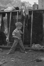 Son of destitute migrant, American River camp, near Sacramento, California, 1936. Creator: Dorothea Lange.