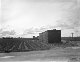 Freight car converted into house in "Little Oklahoma," California, 1936. Creator: Dorothea Lange.
