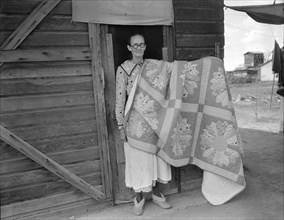 Grandmother from Oklahoma and her pieced quilt, California, Kern County, 1936. Creator: Dorothea Lange.