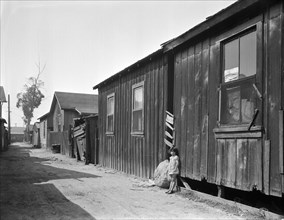 Mexican quarter of Los Angeles, one quarter mile from City Hall, 1936. Creator: Dorothea Lange.