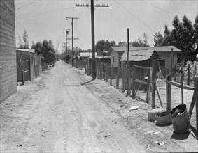 The slums of Brawley, Homes of Mexican field workers, Imperial Valley, California, 1935. Creator: Dorothea Lange.