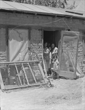 Mexican family, Brawley County, Imperial Valley, California, 1935. Creator: Dorothea Lange.