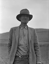 This man is a labor contractor in the pea fields of California, 1936. Creator: Dorothea Lange.