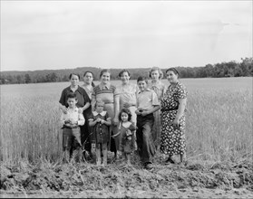 Wives and children of the farm group, Hightstown, New Jersey, 1936. Creator: Dorothea Lange.