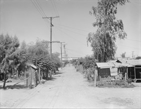 Slums of Brawley, Mexican field workers' homes, Imperial Valley, California, 1936. Creator: Dorothea Lange.