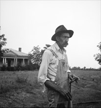 Tenant farmer near Thomaston, Georgia, speaking of the drought, 1936. Creator: Dorothea Lange.