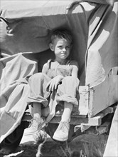Child of an impoverished family from Iowa stranded in New Mexico, 1936. Creator: Dorothea Lange.
