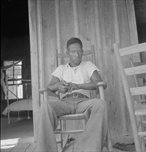 Son of an illiterate sharecropper, near Earle, Arkansas, 1936. Creator: Dorothea Lange.