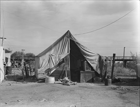 Home of a family of native Californians, migratory workers, Near Porterville, California, 1936. Creator: Dorothea Lange.