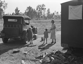 Mother of five children from Oklahoma, now picking cotton in California, near Fresno, 1936. Creator: Dorothea Lange.