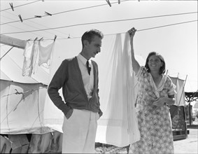 Tom Collins, manager of Kern migrant camp, talking with one of the members, California, 1936. Creator: Dorothea Lange.