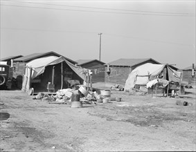 Company housing for cotton workers near Corcoran, California, 1936. Creator: Dorothea Lange.