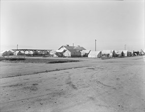View of Kern migrant camp...sanitary units, CA, 1936. Creator: Dorothea Lange.