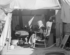 Aged woman from Oklahoma, Kern County migrant camp, California, 1936. Creator: Dorothea Lange.