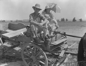 Drought-stricken farmer and family near Muskogee, Oklahoma, 1939. Creator: Dorothea Lange.