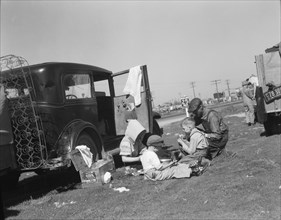 Oklahomans bound for Oregon along a highway in California, 1937. Creator: Dorothea Lange.