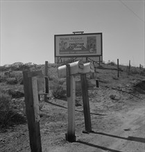 Billboard on U.S. Highway 99, California, 1937. Creator: Dorothea Lange.