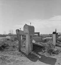 Mail boxes and irrigation gates, Imperial Valley, California, 1937. Creator: Dorothea Lange.
