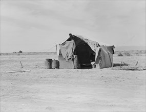 Tent housing a family, Imperial County, California, 1937. Creator: Dorothea Lange.
