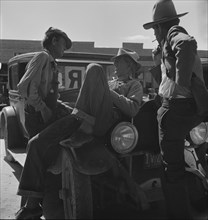 Drought refugees waiting for relief checks, Calipatria, California, 1937. Creator: Dorothea Lange.