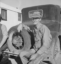 Oklahoman from Chickasaw in potato pickers' camp, Kern County, California, 1937. Creator: Dorothea Lange.