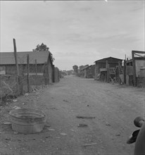 Slums of East El Centro, California, 1937. Creator: Dorothea Lange.